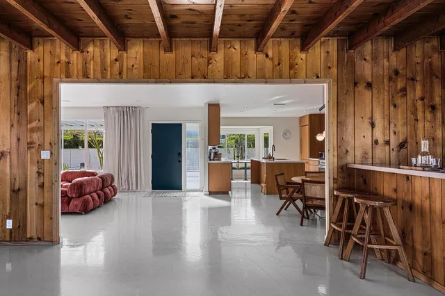 a view of a livingroom with furniture and a garage