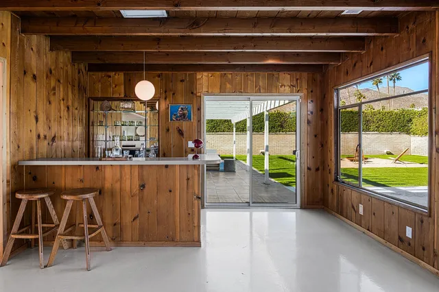 a view of swimming pool with outdoor seating