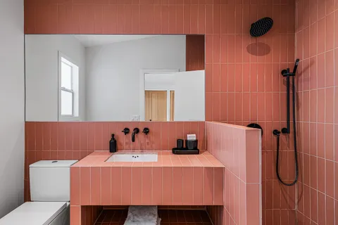 a bathroom with a sink toilet and shower