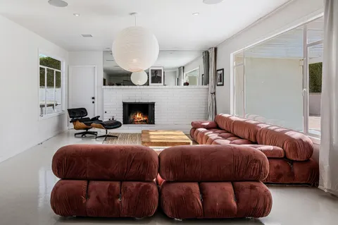 a bedroom with bed and a fireplace