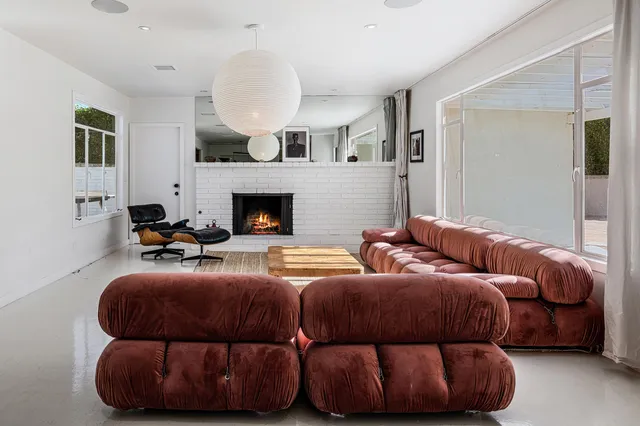 a bedroom with bed and a fireplace