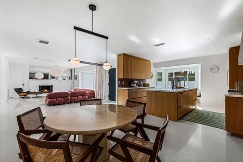 a view of kitchen dining table and chairs