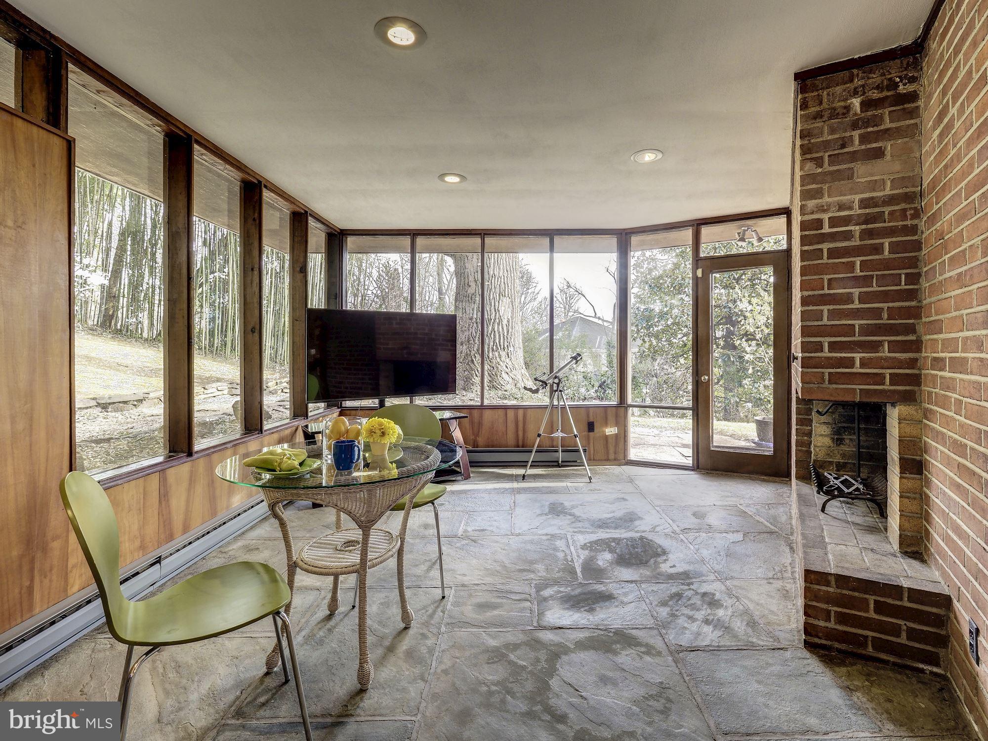 6528 Wiscasset Road Bethesda, MD 20816 - Photo 17 of 38 Sunroom with Fireplace - Awesome!