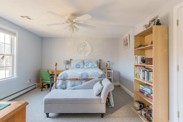 a bedroom with a bed furniture and a window