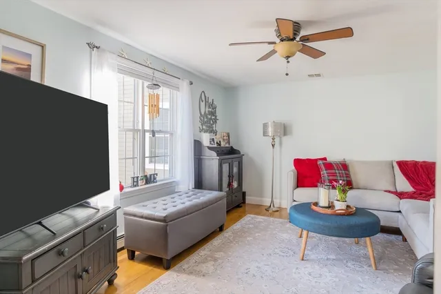 a living room with furniture and a window