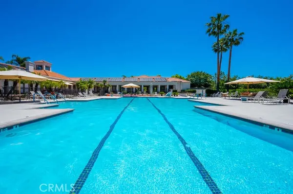 a view of a swimming pool with a table and chairs