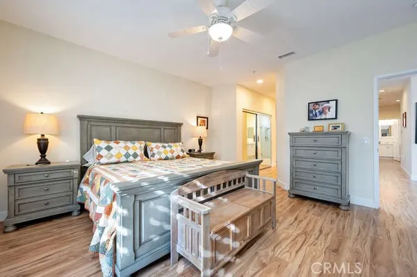 a bed room with a bed and dresser
