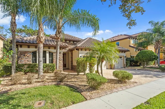 a view of a hallway with furniture and a window