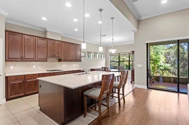 a bedroom with a bed and a dresser next to a window
