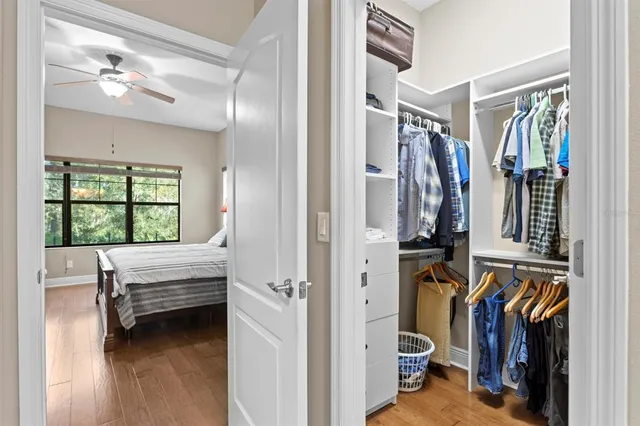 a view of a workspace with furniture and wooden floor