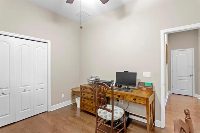an aerial view of house with yard and mountain view in back