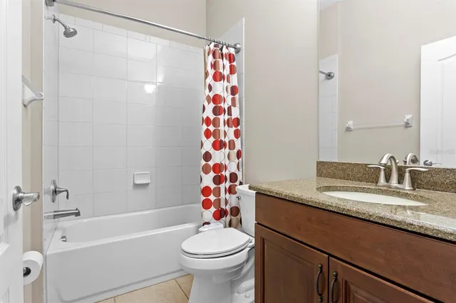 an aerial view of a house with a lake view