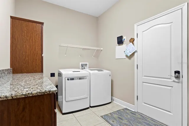 an aerial view of house with yard and lake view