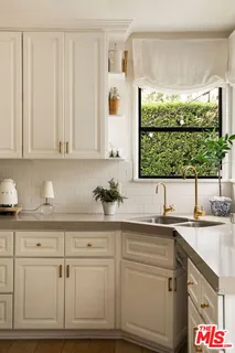 a kitchen with a sink and a window
