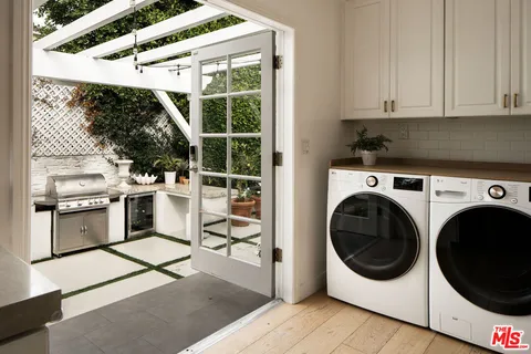 a kitchen with a stove and a chair