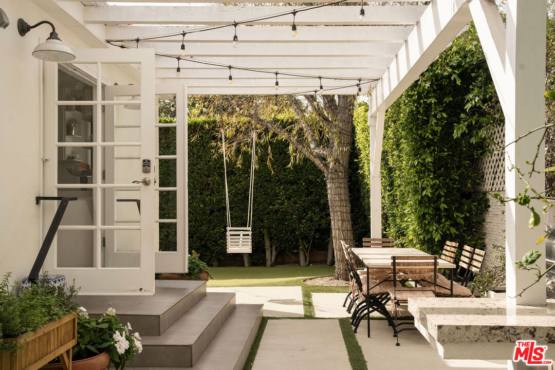 4080 Alla Road Los Angeles, CA 90066 - Photo 24 of 57 a view of a patio with table and chairs and potted plants