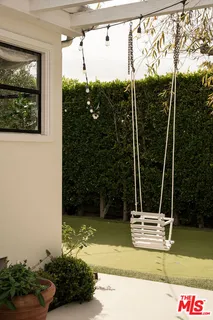 a view of a swimming pool and trees in the background