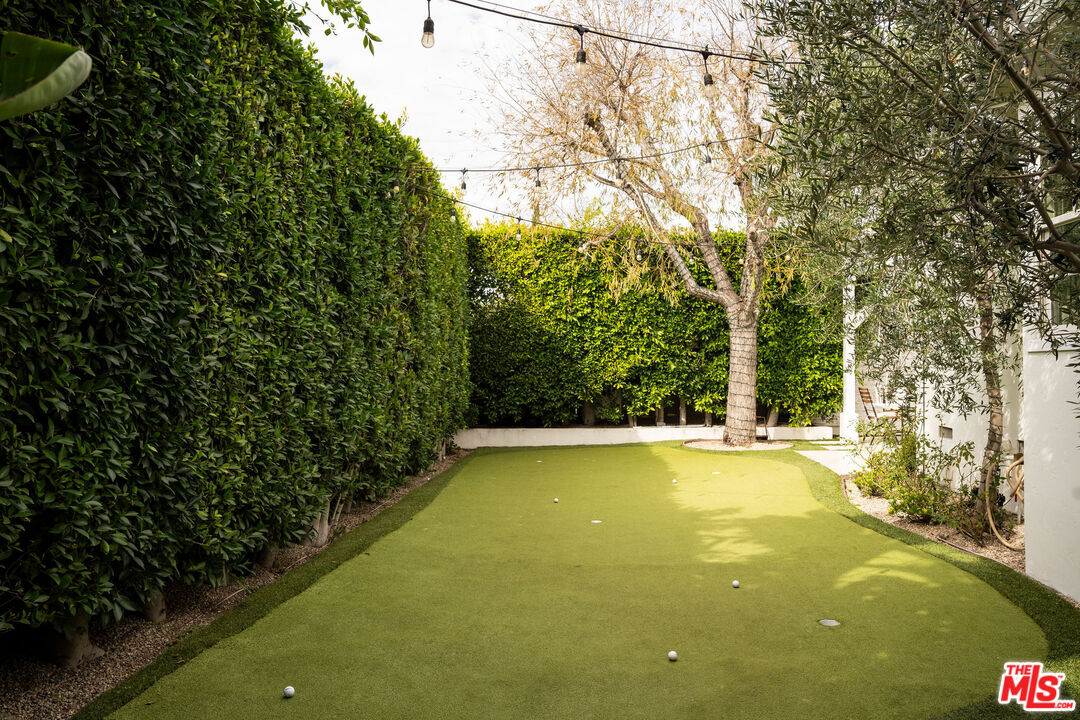 4080 Alla Road Los Angeles, CA 90066 - Photo 27 of 57 a view of a swimming pool and trees in the background