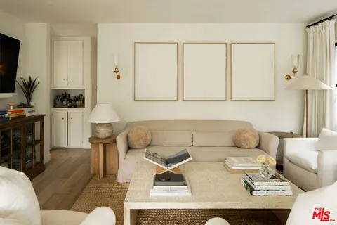 a living room with a couch and a table