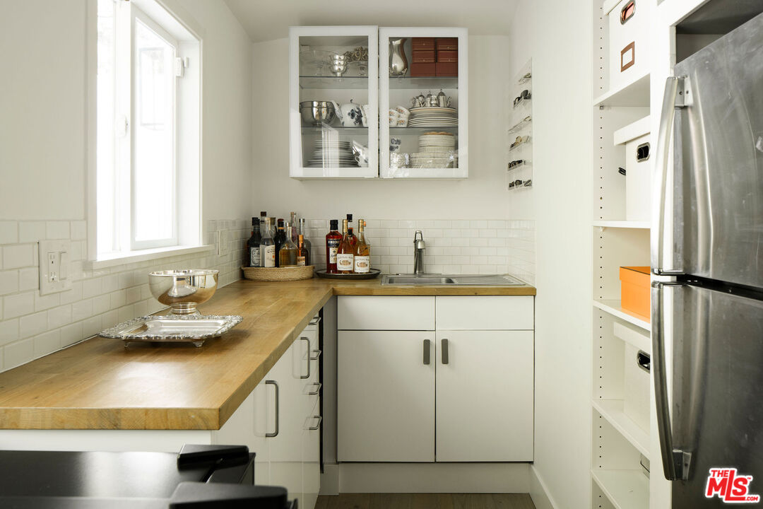 4080 Alla Road Los Angeles, CA 90066 - Photo 54 of 57 a kitchen with a sink and a refrigerator