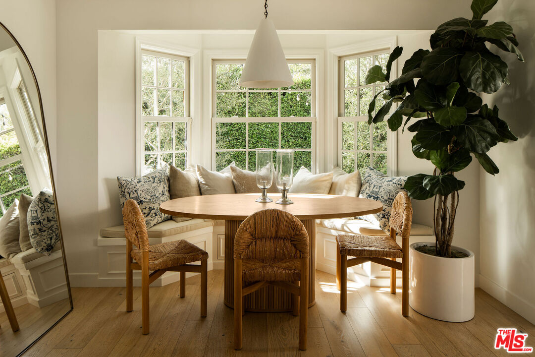 4080 Alla Road Los Angeles, CA 90066 - Photo 8 of 57 a dining room with furniture potted plants and wooden floor