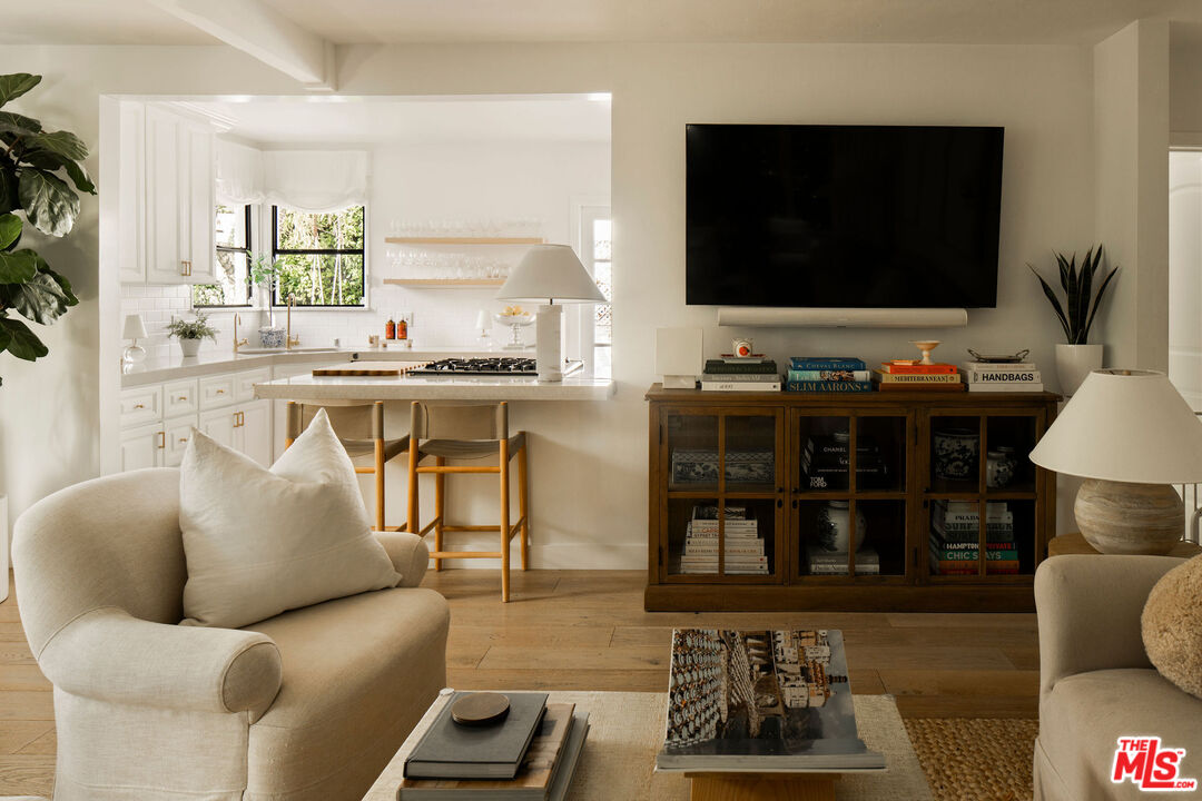 4080 Alla Road Los Angeles, CA 90066 - Photo 10 of 57 a living room with furniture a flat screen tv and kitchen view