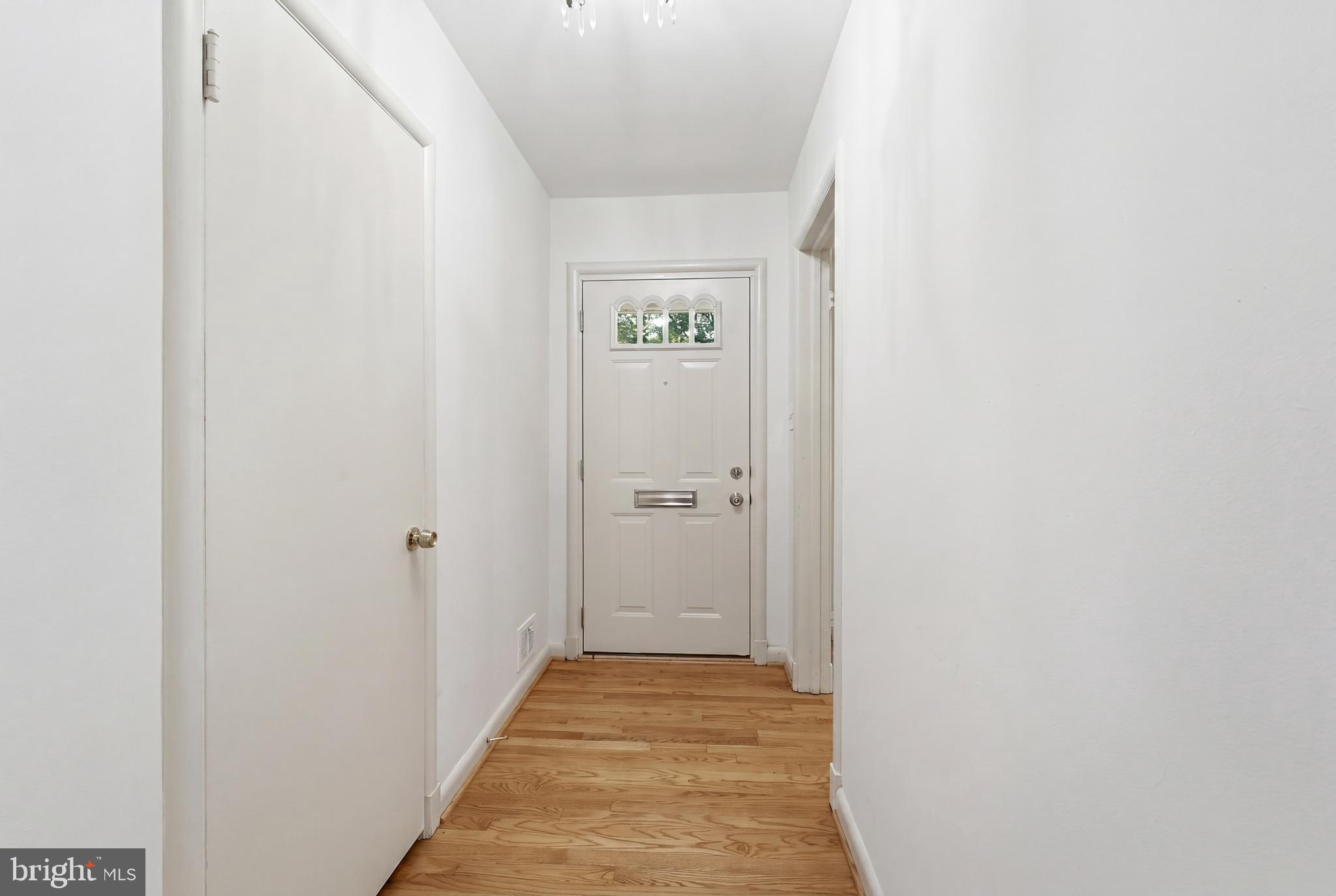 228 Northwest Terrace Silver Spring, MD 20901 - Photo 4 of 70 a view of a hallway with wooden floor