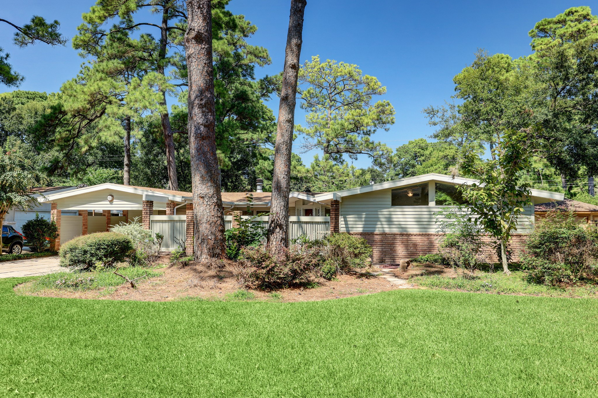 a front view of a house with garden