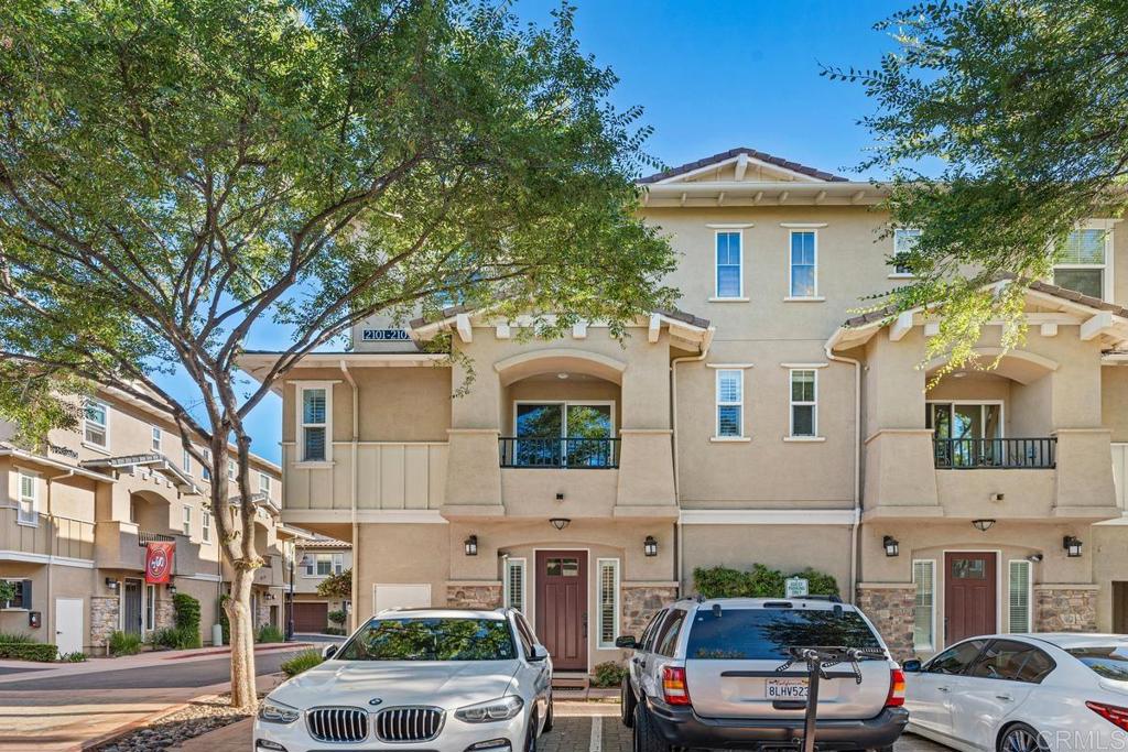2101 Cosmo Way San Marcos, CA 92078 - Photo 1 of 1 a front view of a building with parking space