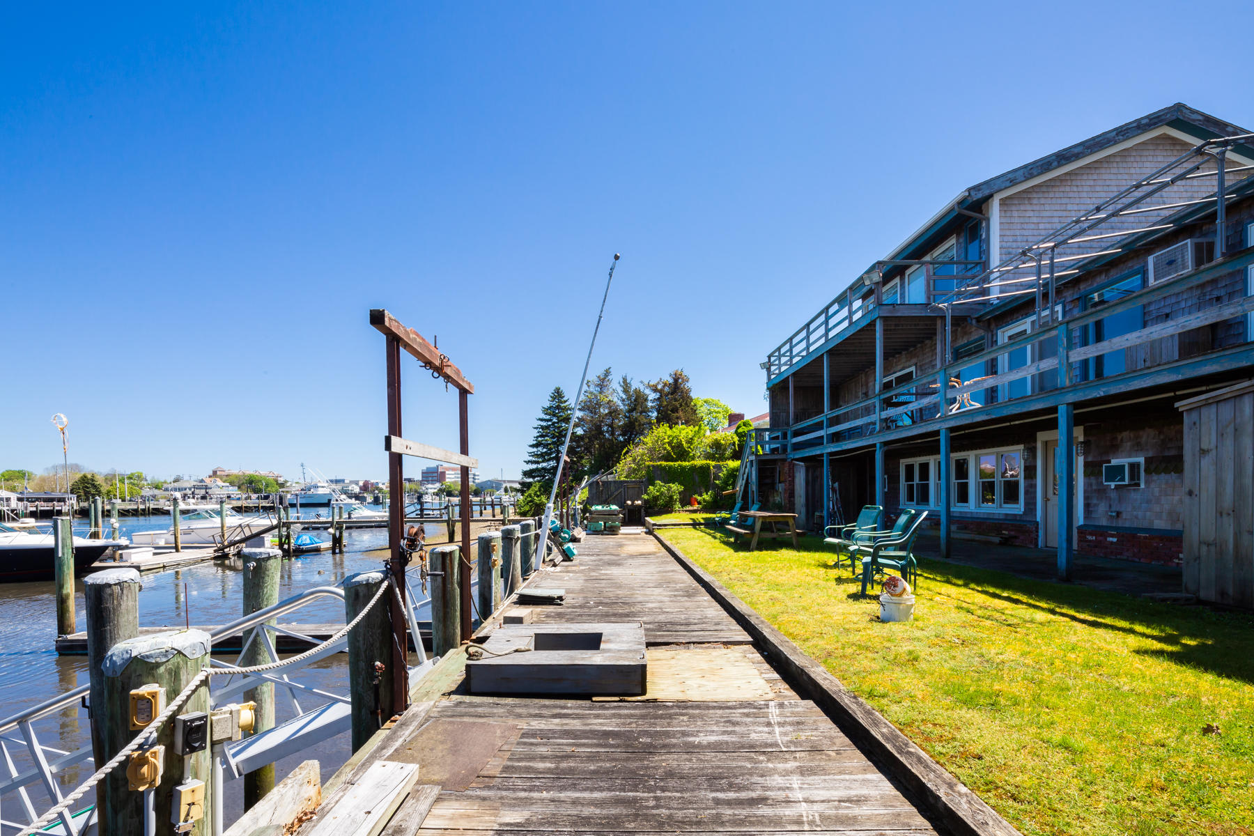54 Channel Point Road Hyannis, MA 02601 - Photo 1 of 18 a view of swimming pool with outdoor seating and a buildings