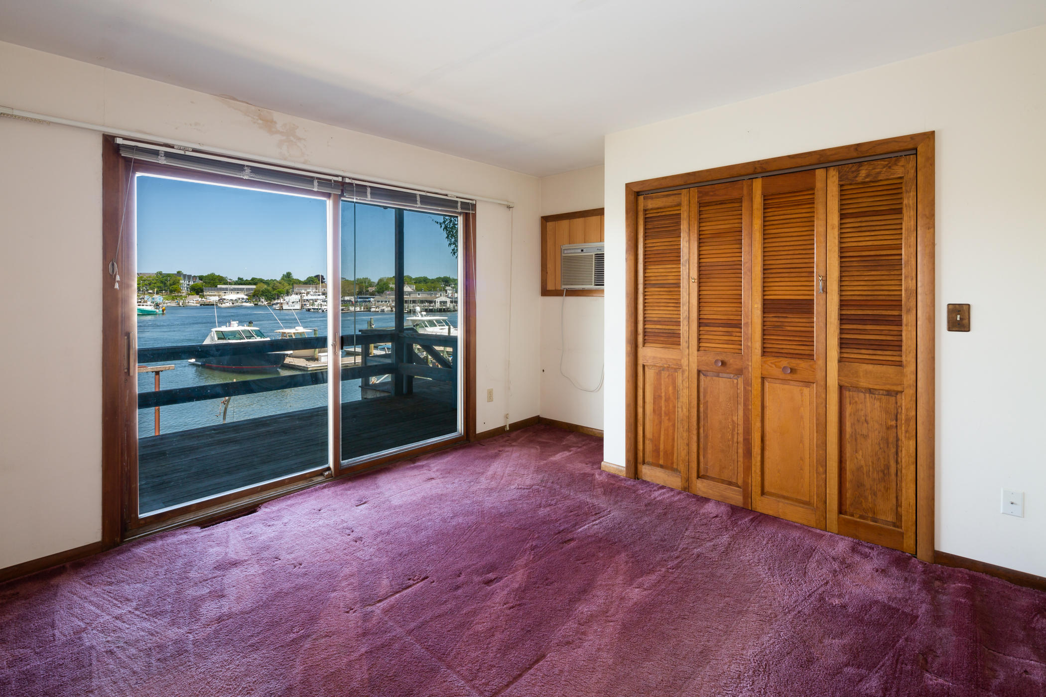 54 Channel Point Road Hyannis, MA 02601 - Photo 13 of 18 an empty room with sliding door