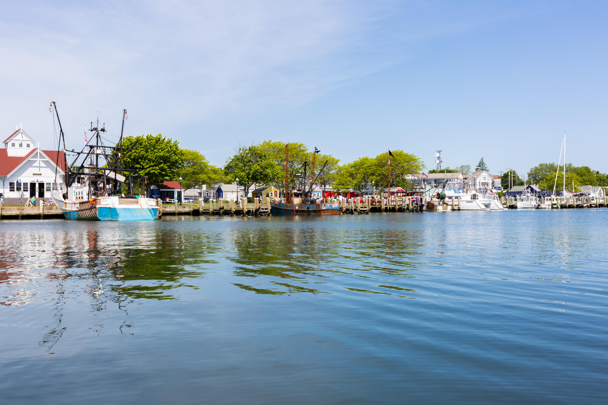54 Channel Point Road Hyannis, MA 02601 - Photo 16 of 18 a view of a lake with boats and trees in the background