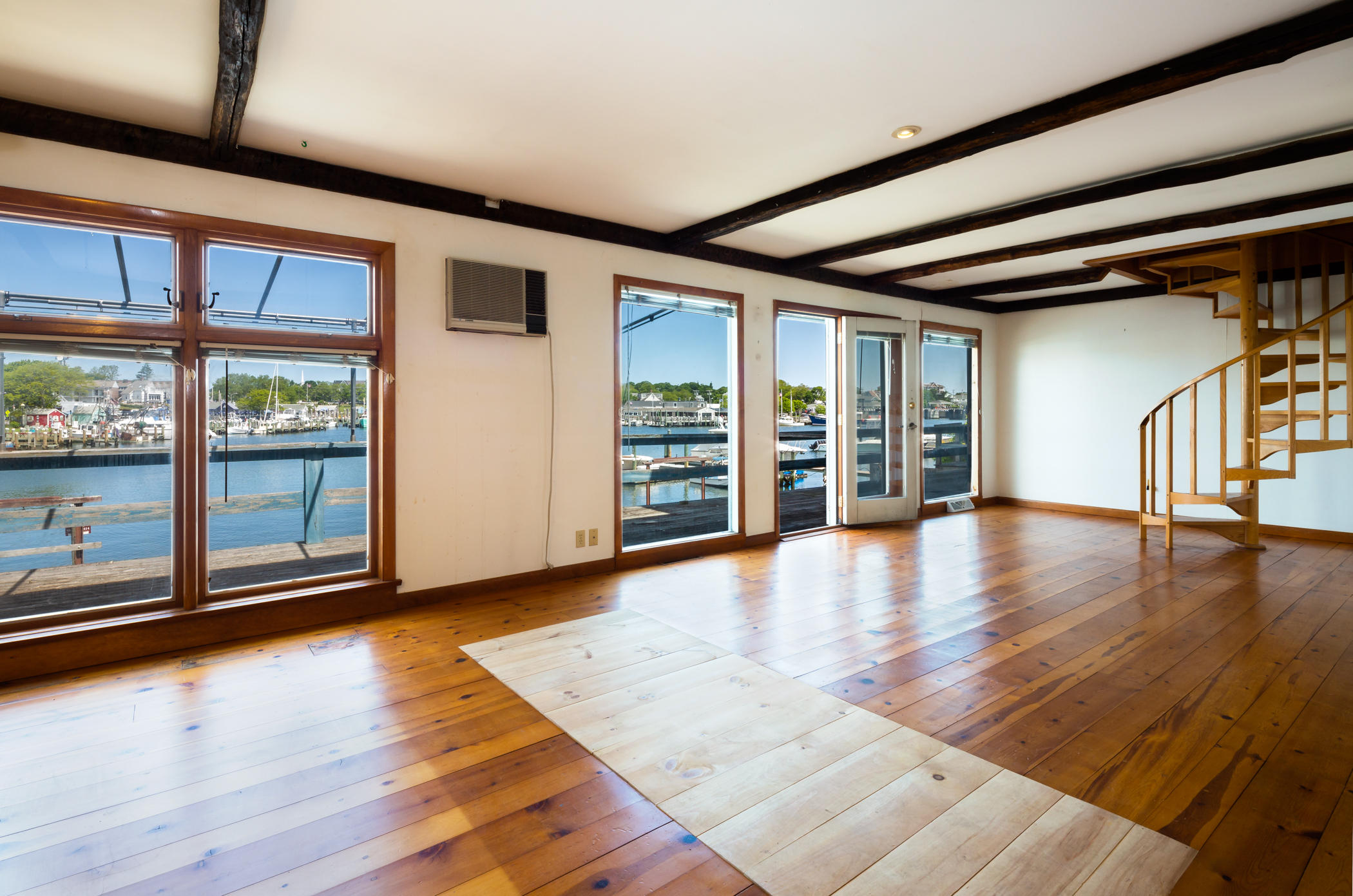 54 Channel Point Road Hyannis, MA 02601 - Photo 9 of 18 a view of an empty room with wooden floor and a window