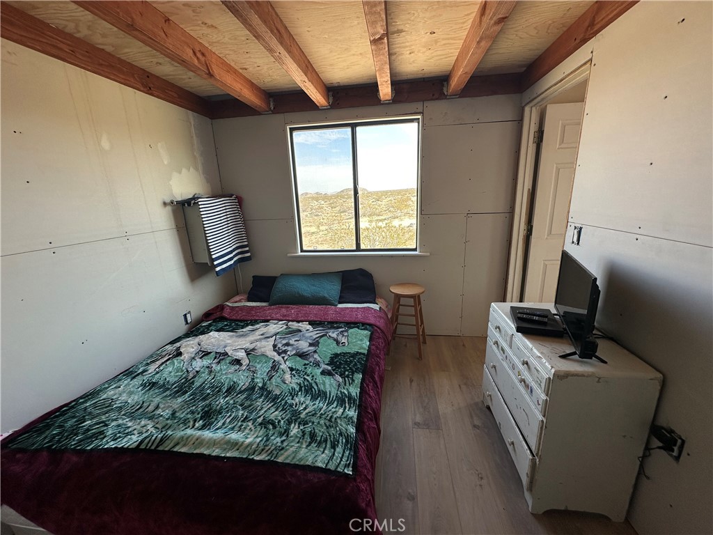 777 Walker Road Johnson Valley, CA 92285 - Photo 8 of 21 a bedroom with furniture and a window