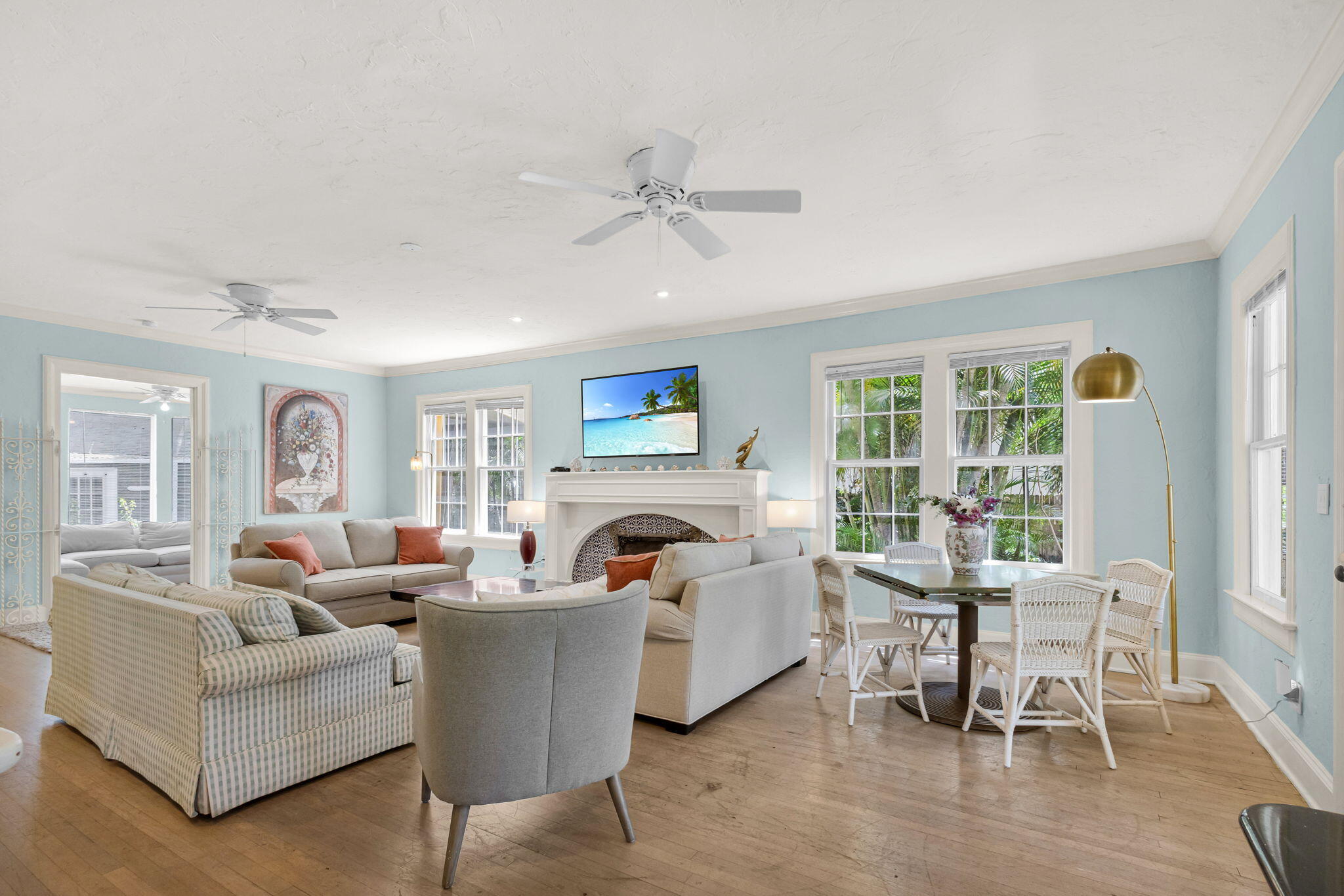 519 28th Street, Unit MAIN HOUSE West Palm Beach, FL 33407 - Photo 10 of 67 a living room with furniture a fireplace and a large window
