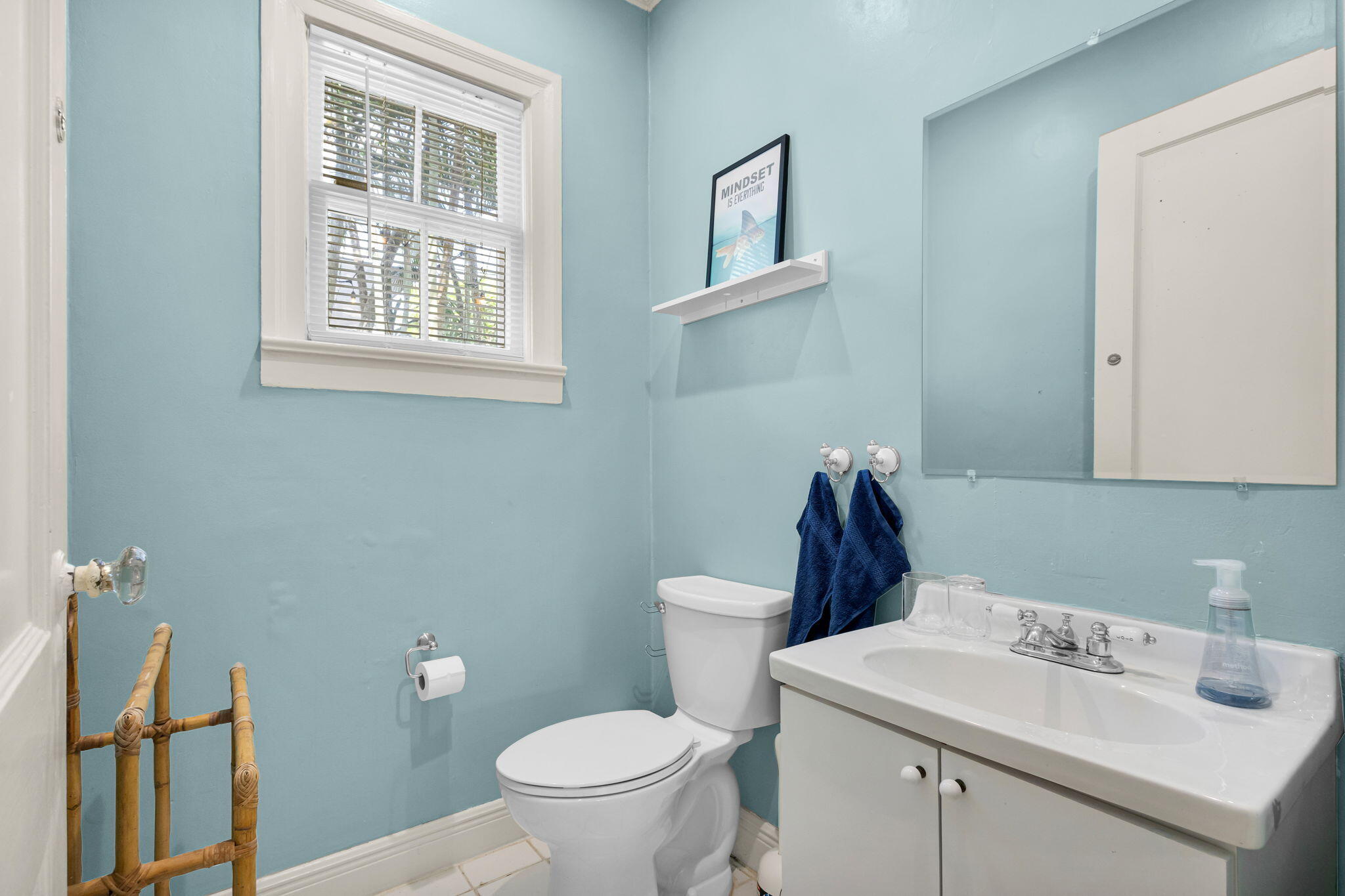 519 28th Street, Unit MAIN HOUSE West Palm Beach, FL 33407 - Photo 20 of 67 a bathroom with a sink a toilet and a mirror