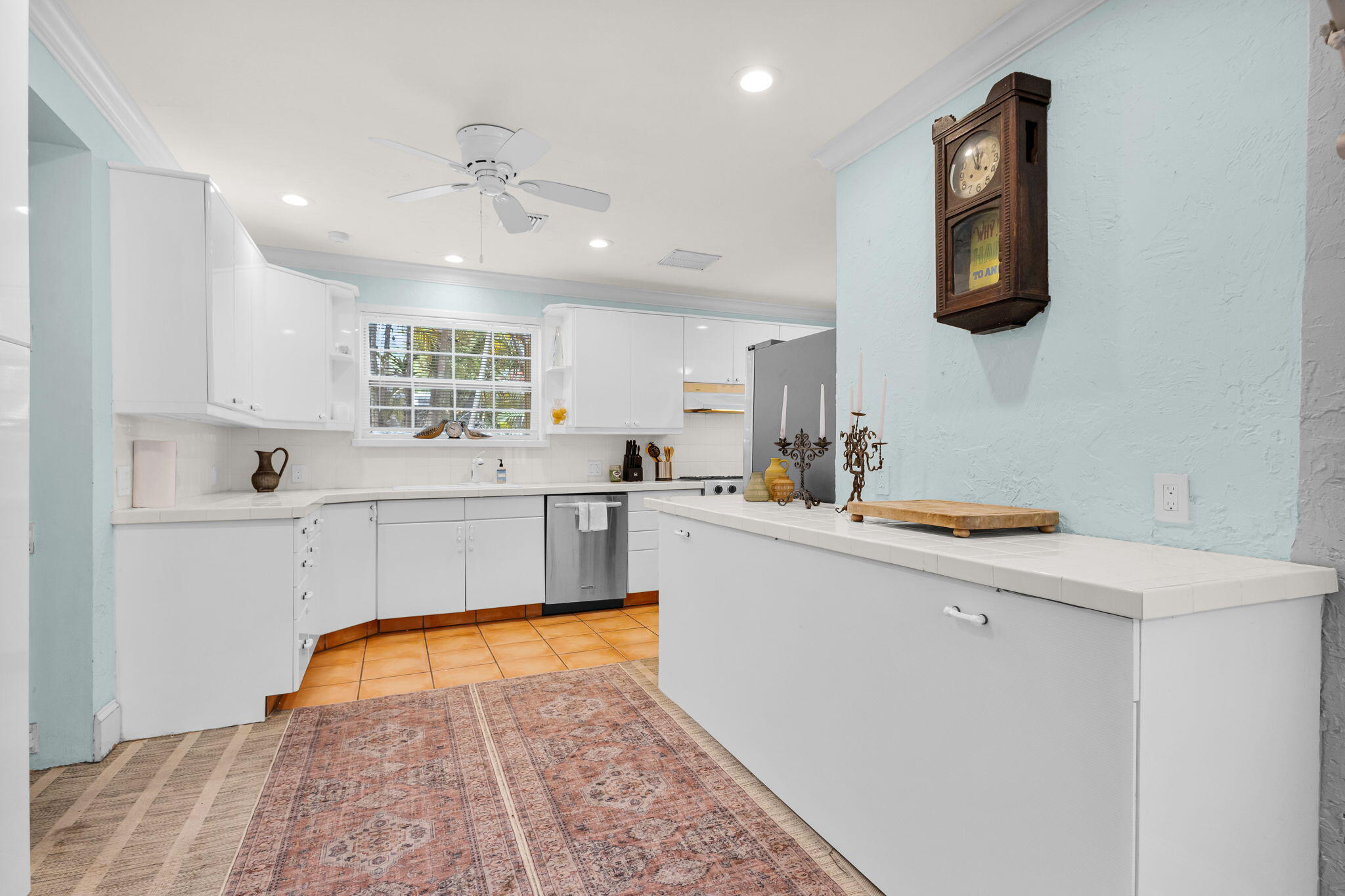 519 28th Street, Unit MAIN HOUSE West Palm Beach, FL 33407 - Photo 21 of 67 a kitchen with stainless steel appliances cabinets a sink and a refrigerator