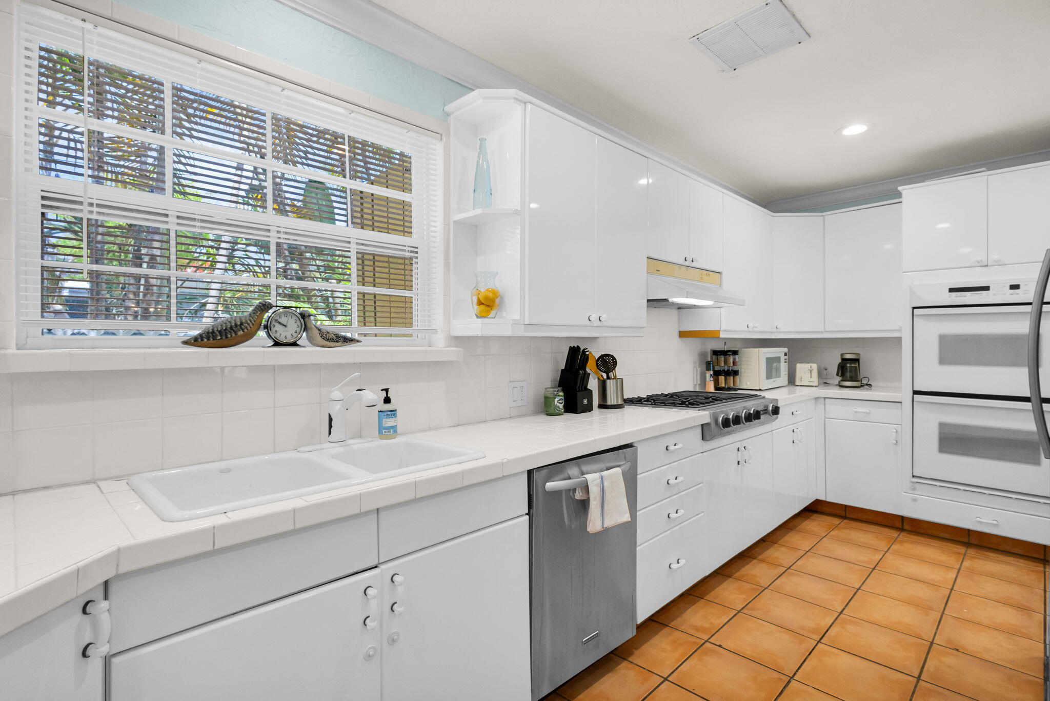 519 28th Street, Unit MAIN HOUSE West Palm Beach, FL 33407 - Photo 24 of 67 a kitchen with a sink window and cabinets