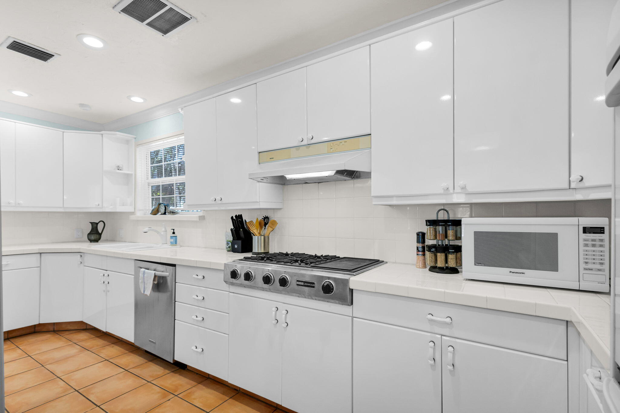 519 28th Street, Unit MAIN HOUSE West Palm Beach, FL 33407 - Photo 27 of 67 a kitchen with cabinets appliances a sink and a counter space