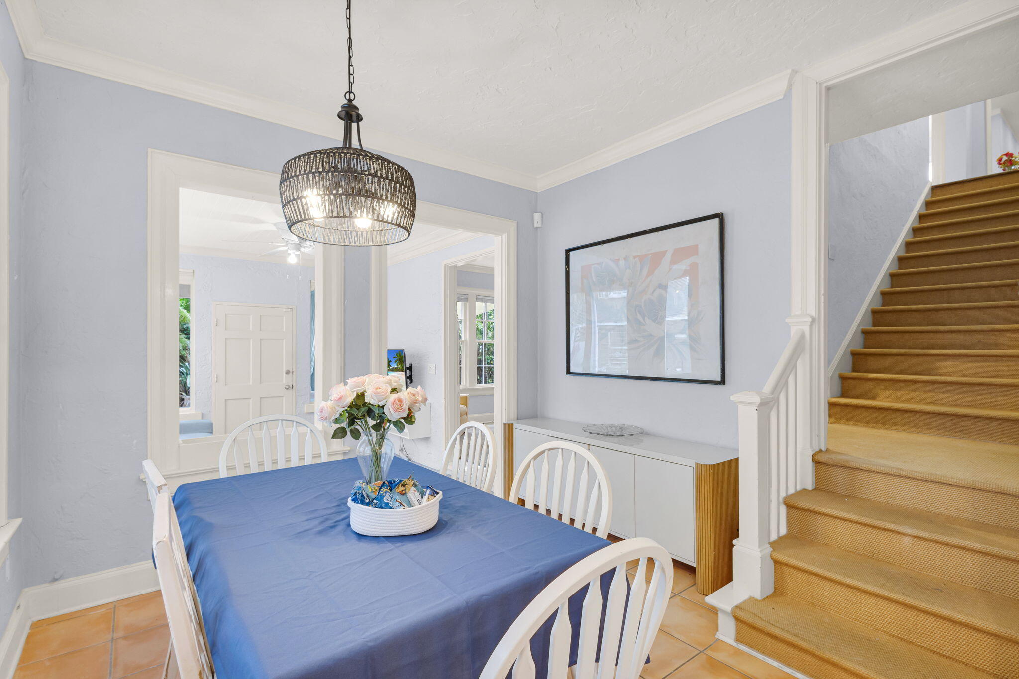 519 28th Street, Unit MAIN HOUSE West Palm Beach, FL 33407 - Photo 29 of 67 a view of a dining room with furniture wooden floor and a chandelier