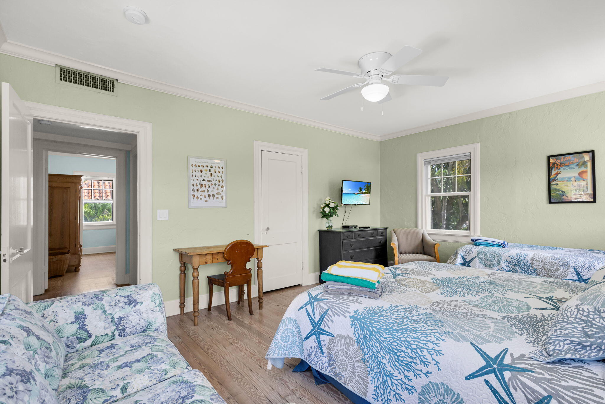 519 28th Street, Unit MAIN HOUSE West Palm Beach, FL 33407 - Photo 36 of 67 a bedroom with a bed and wooden floor