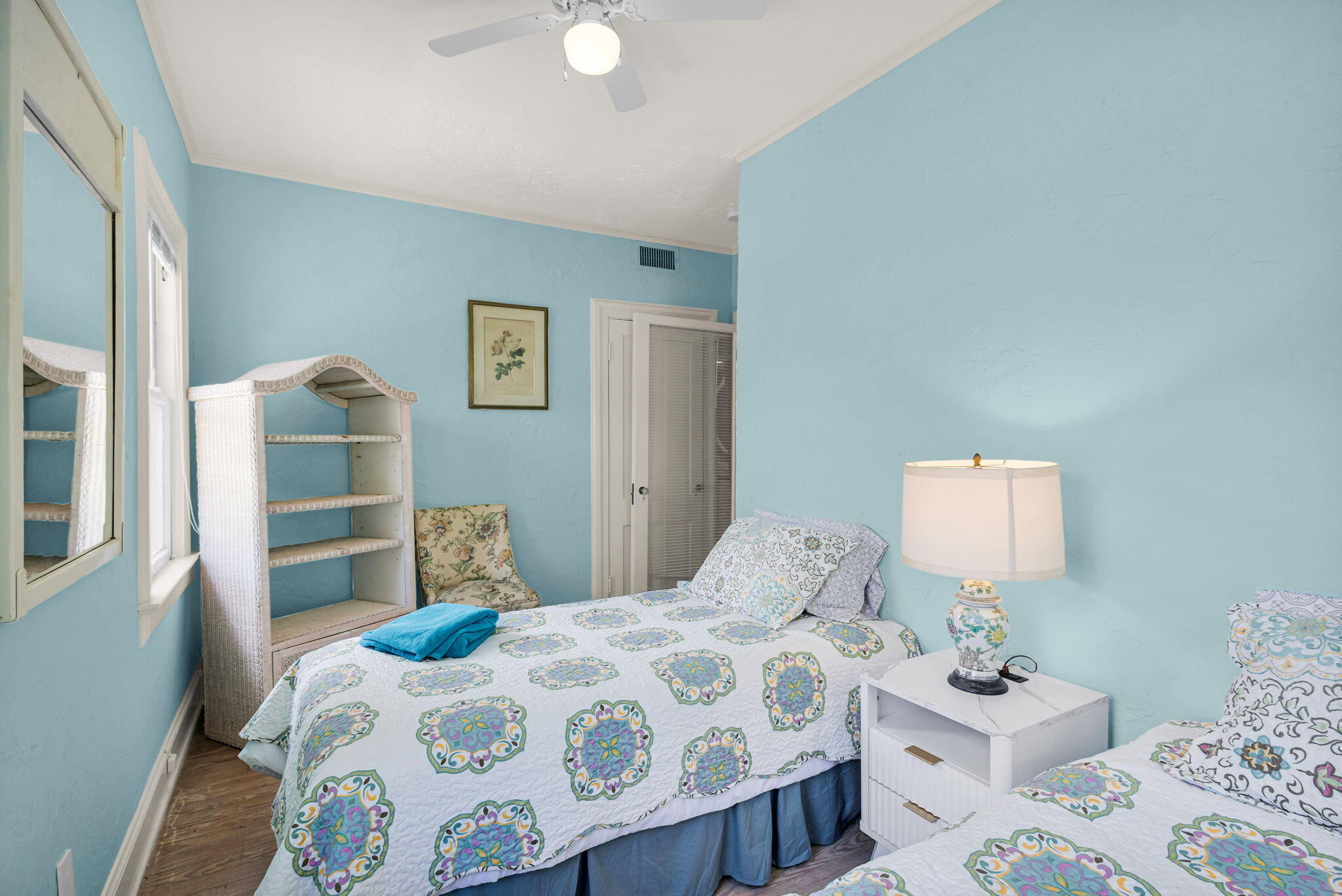 519 28th Street, Unit MAIN HOUSE West Palm Beach, FL 33407 - Photo 48 of 67 a bedroom with a bed and wooden floor