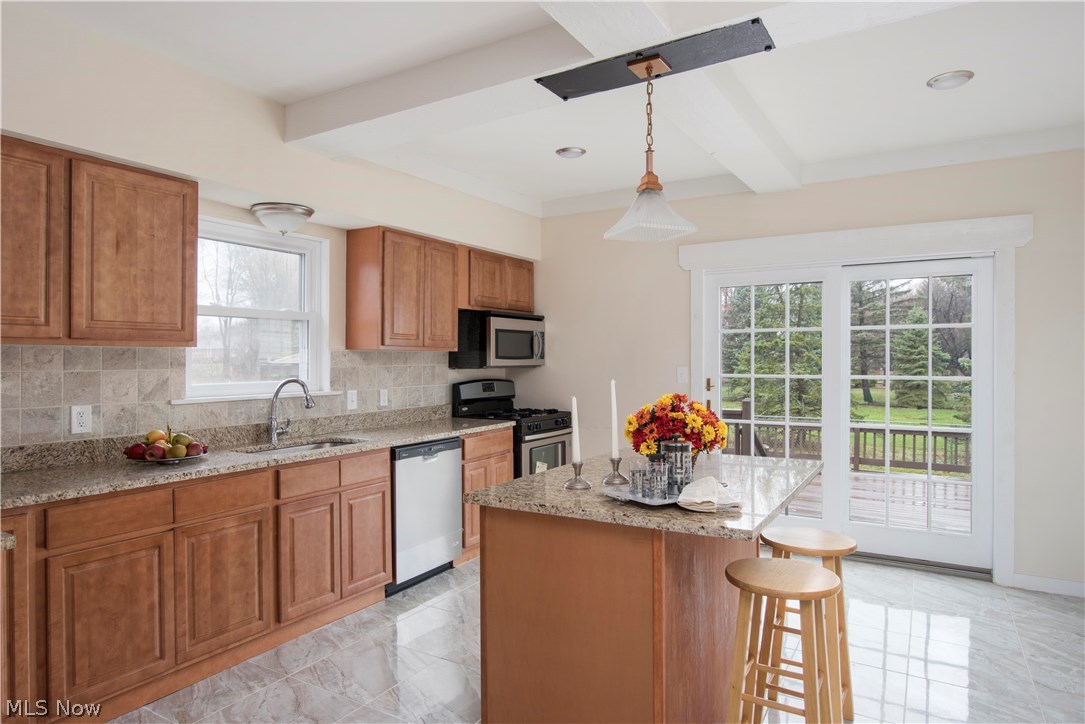 5452 Highland Road Cleveland, OH 44143 - Photo 5 of 29 This picturesque kitchen will inspire you to create delicious meals! Look up to justice the coffered ceiling! Enjoy the view while looking through the sliders!