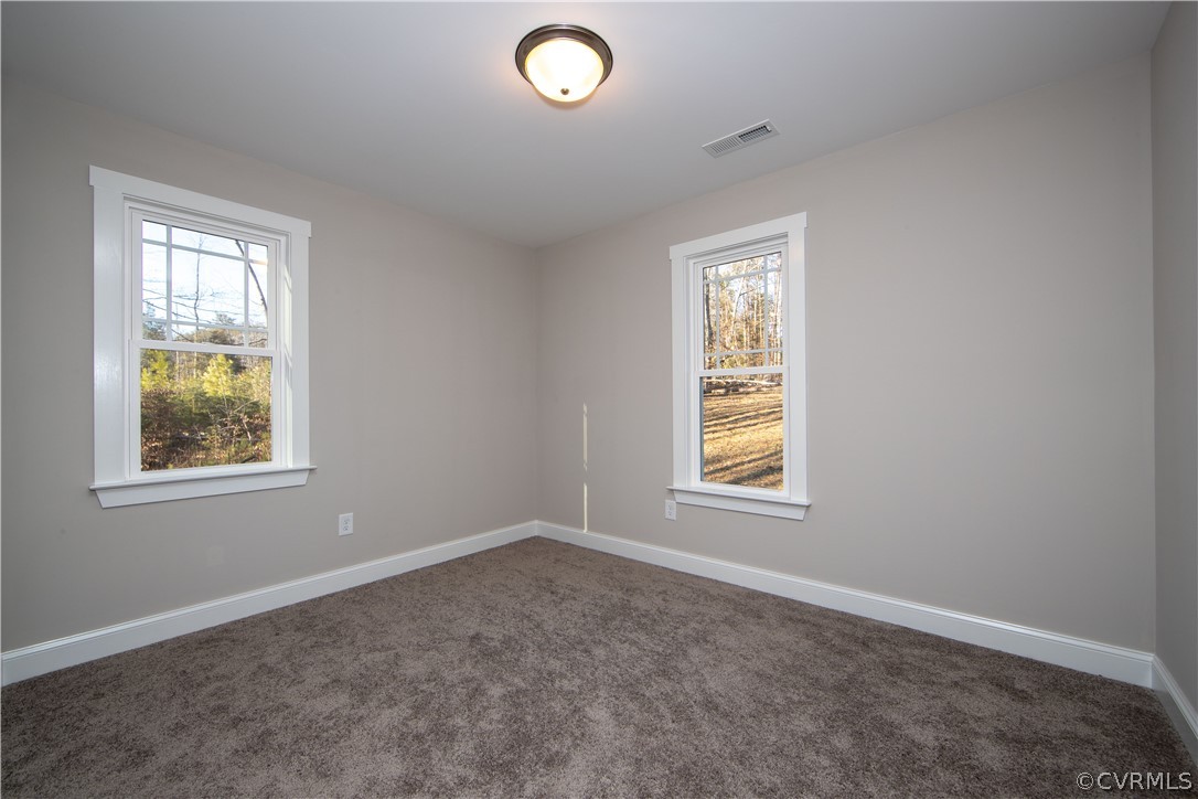 6711 Cross County Road Gum Spring, VA 23065 - Photo 15 of 21 Bedroom three also offers carpet and lots of natur