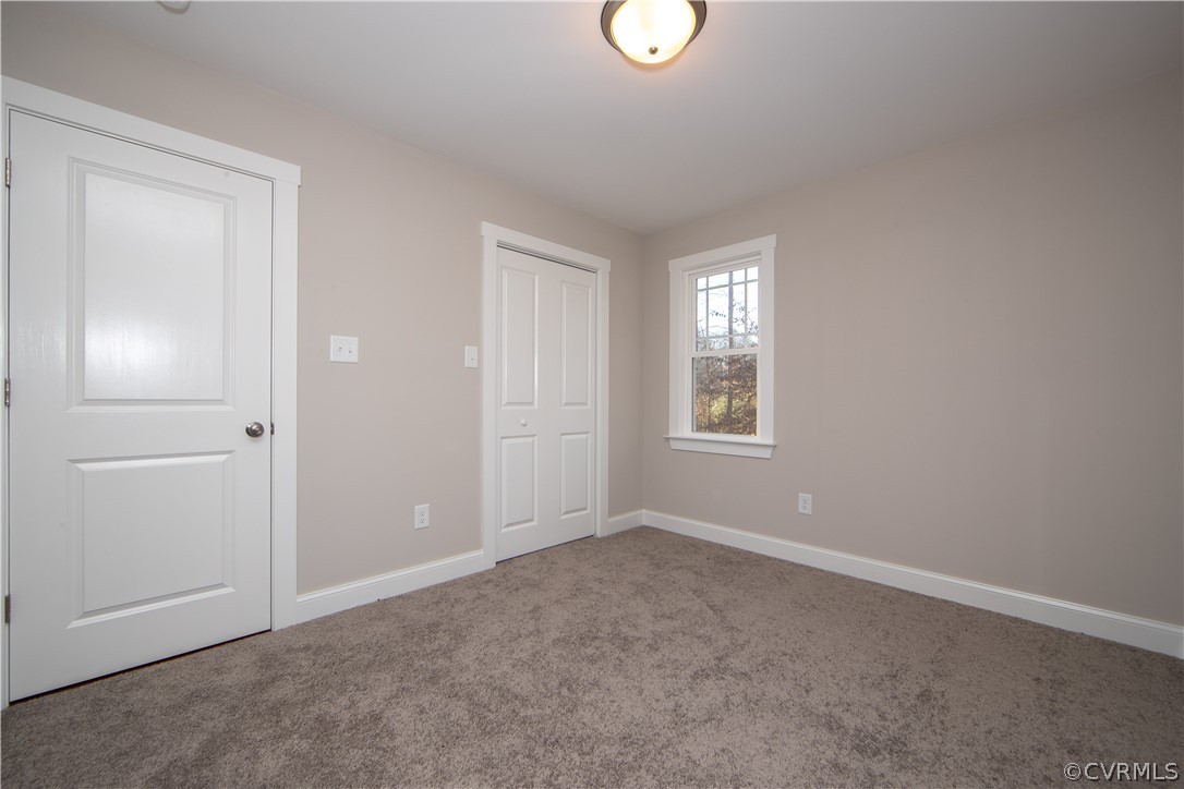 6711 Cross County Road Gum Spring, VA 23065 - Photo 16 of 21 Bedroom three offers a large closet.