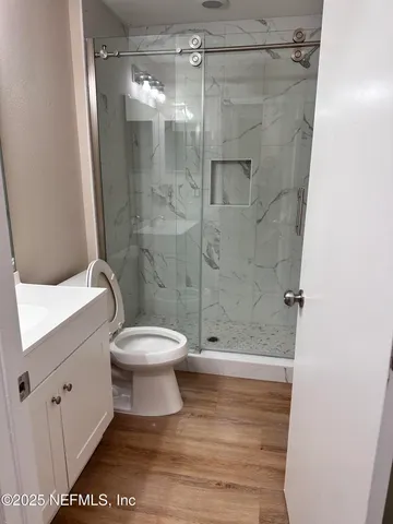 a front view of a house with a yard and more windows