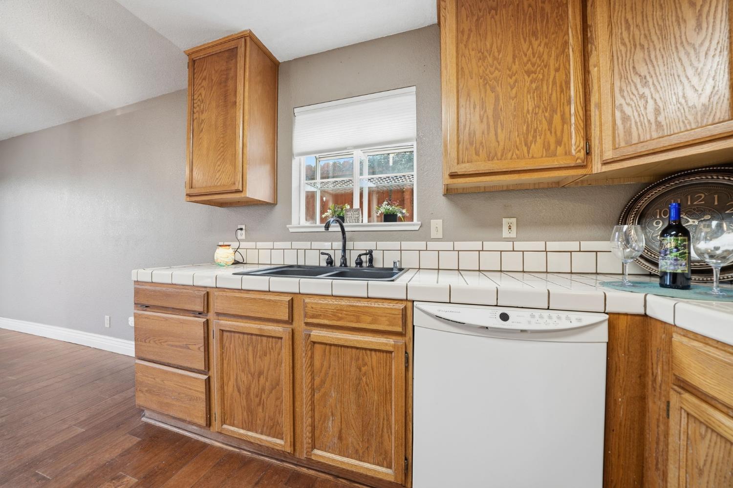 101 Terrace View Circle Jackson, CA 95642 - Photo 11 of 28 a kitchen with stainless steel appliances granite countertop a sink and cabinets with wooden floor