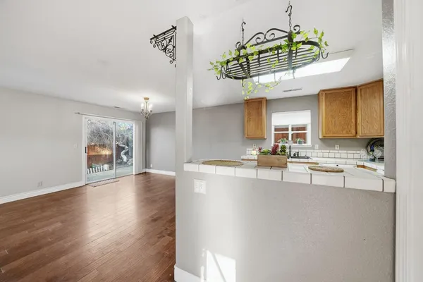 a view of a kitchen with a sink stainless steel appliances and cabinets