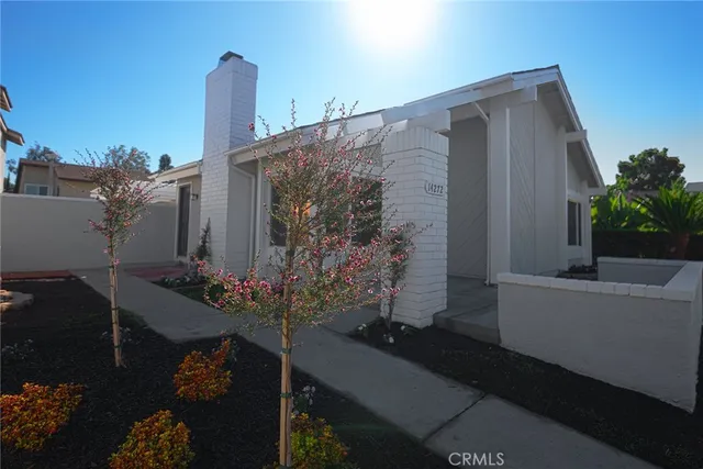 a front view of a house with outdoor space and sitting area
