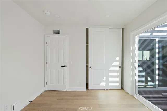 a view of entryway with wooden floor